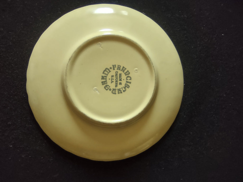 Close-up of SCRATCH on exterior of Franciscan Ware Swirl yellow cream soup bowl