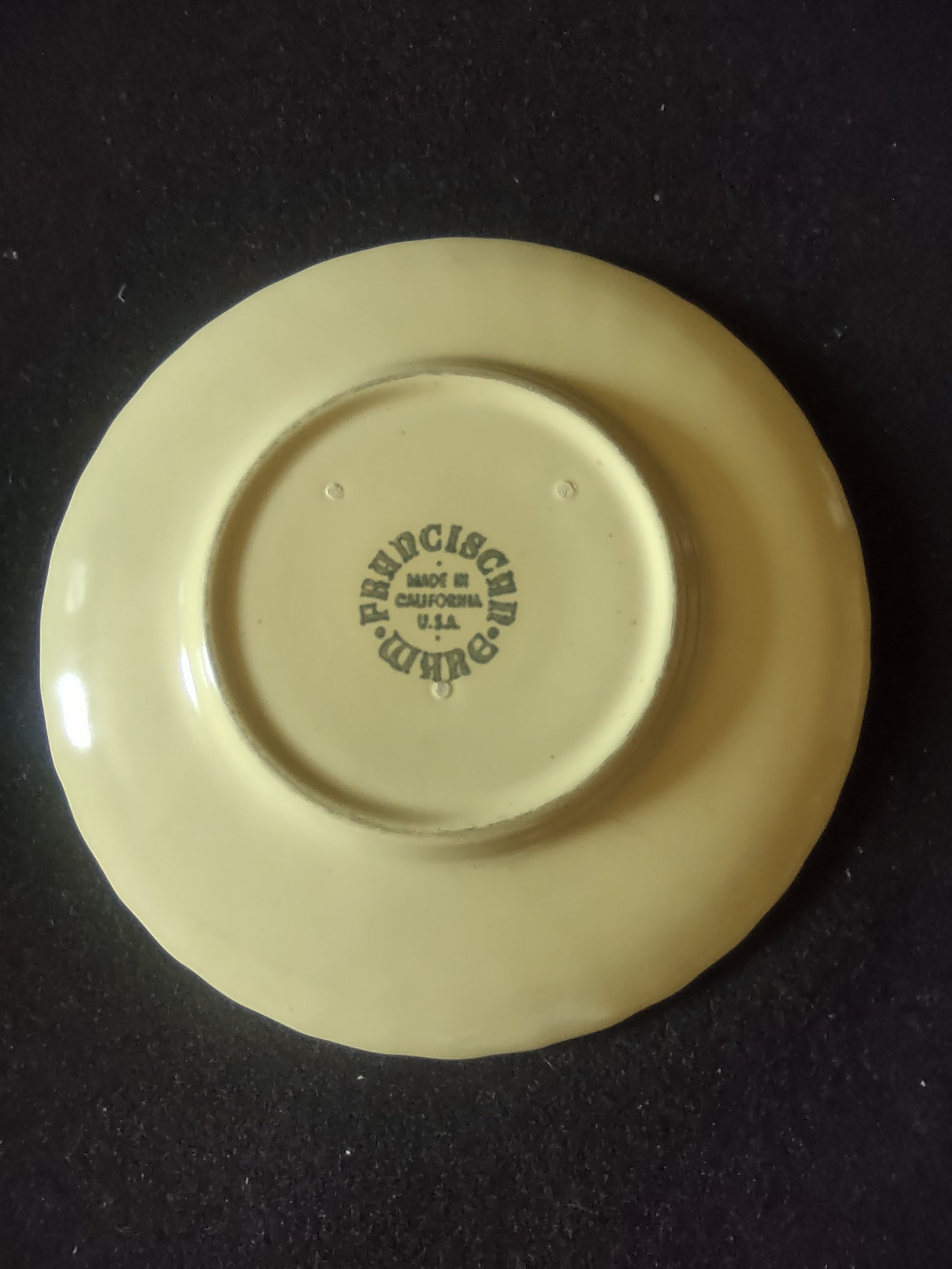 Vintage Franciscan Ware Swirl Cream Saucer - close-up of rim showing chip