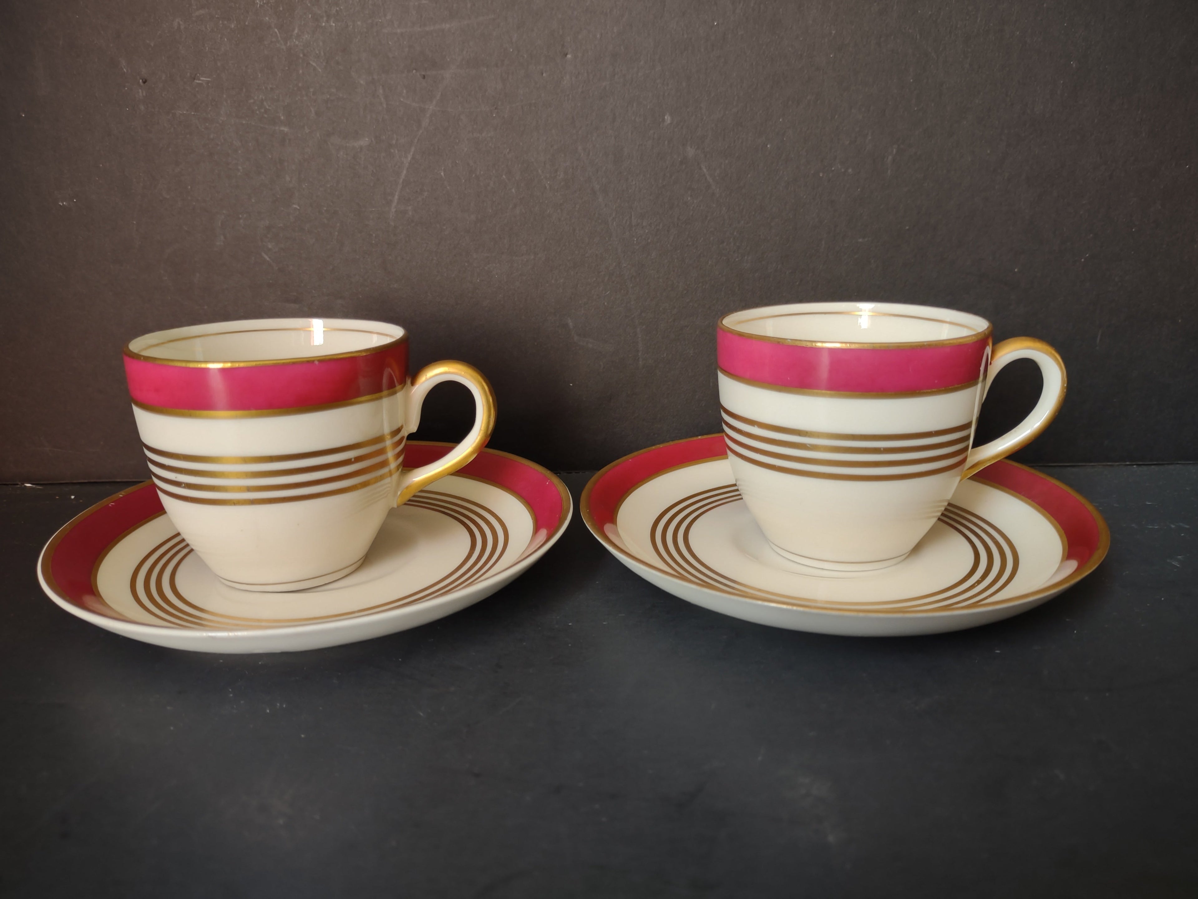 Vintage Warwick China crimson red and gold demitasse cup and saucer sets of 2 front view