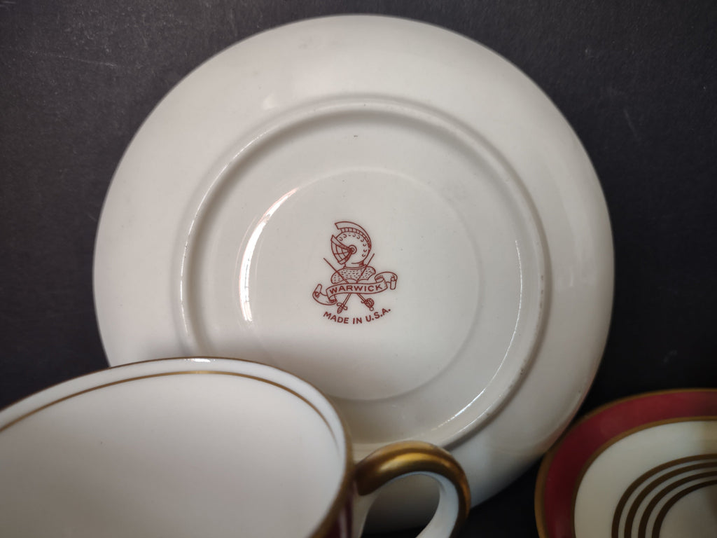 Warwick China demitasse saucer with ruler showing approximately 4.5 inch diameter