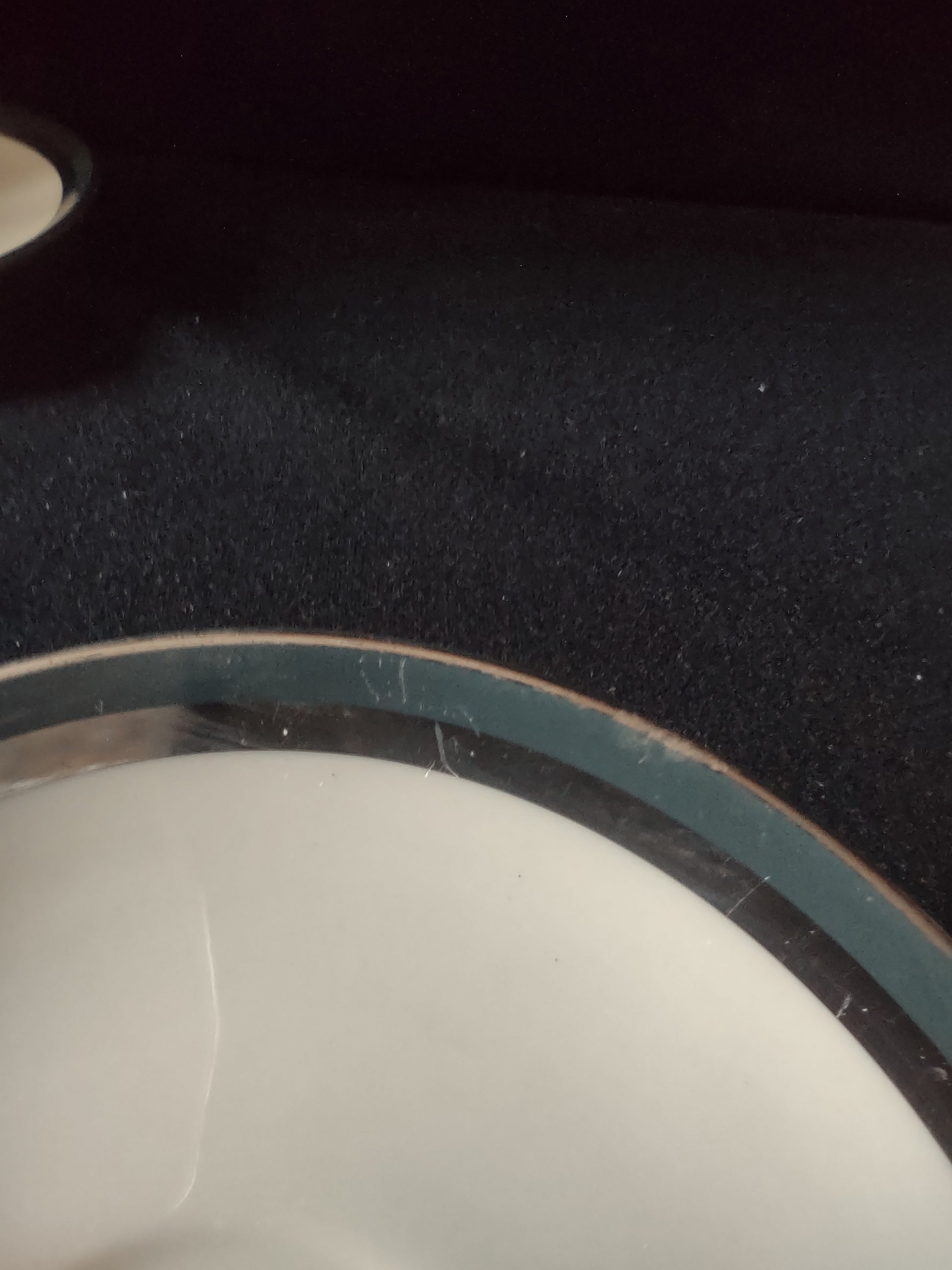 Flintridge China saucer with ruler showing approximately 6 inch diameter