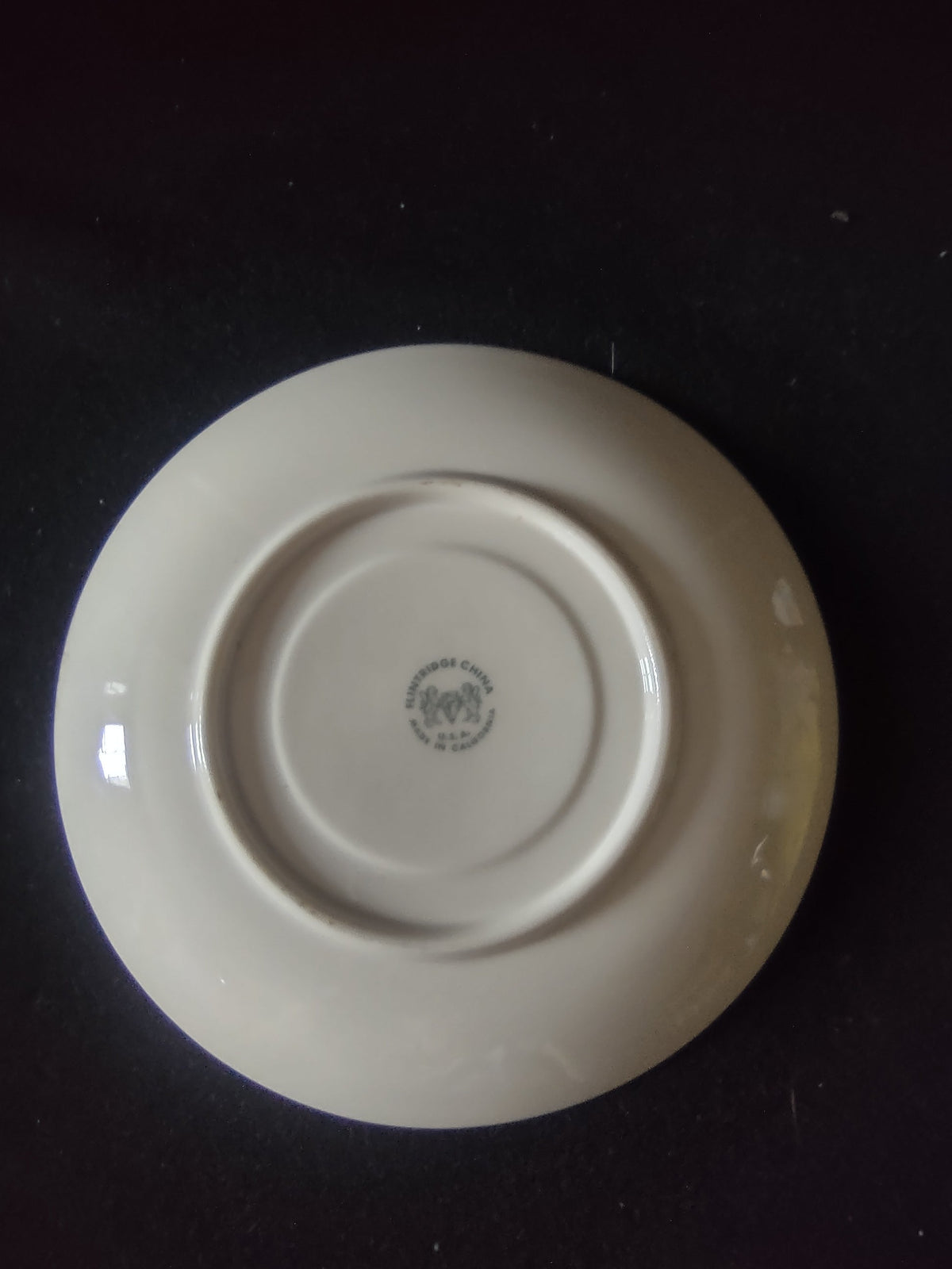 Flintridge China saucer rim edge detail showing chip