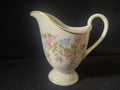Vintage footed creamer side view - blue and pink floral pattern