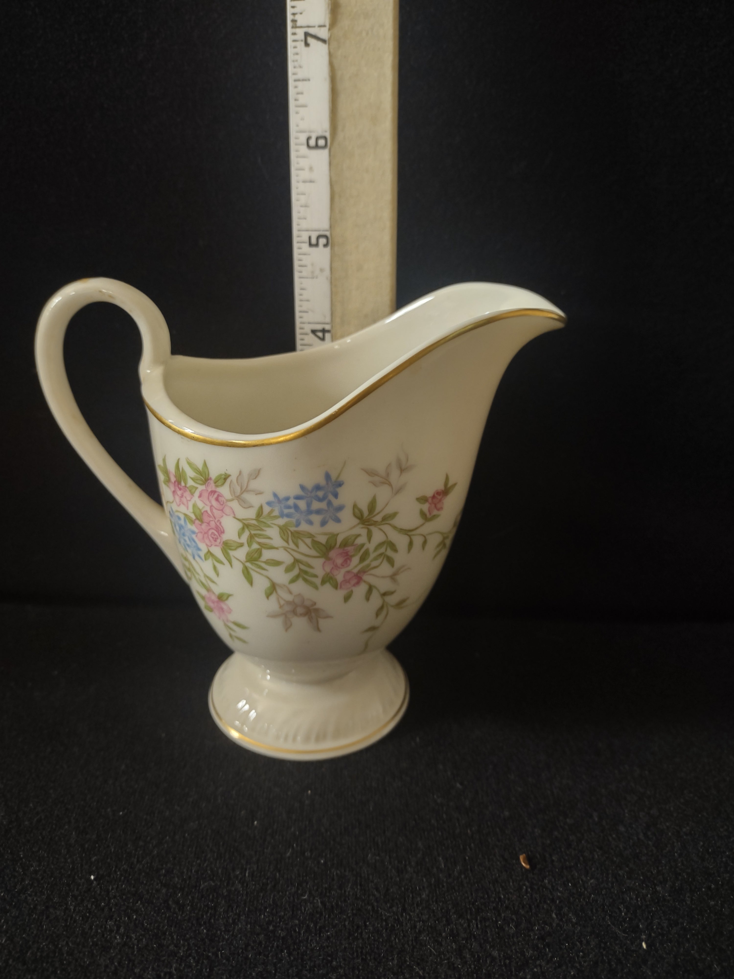 Vintage footed creamer front view - pink rose and blue floral pattern with gold trim
