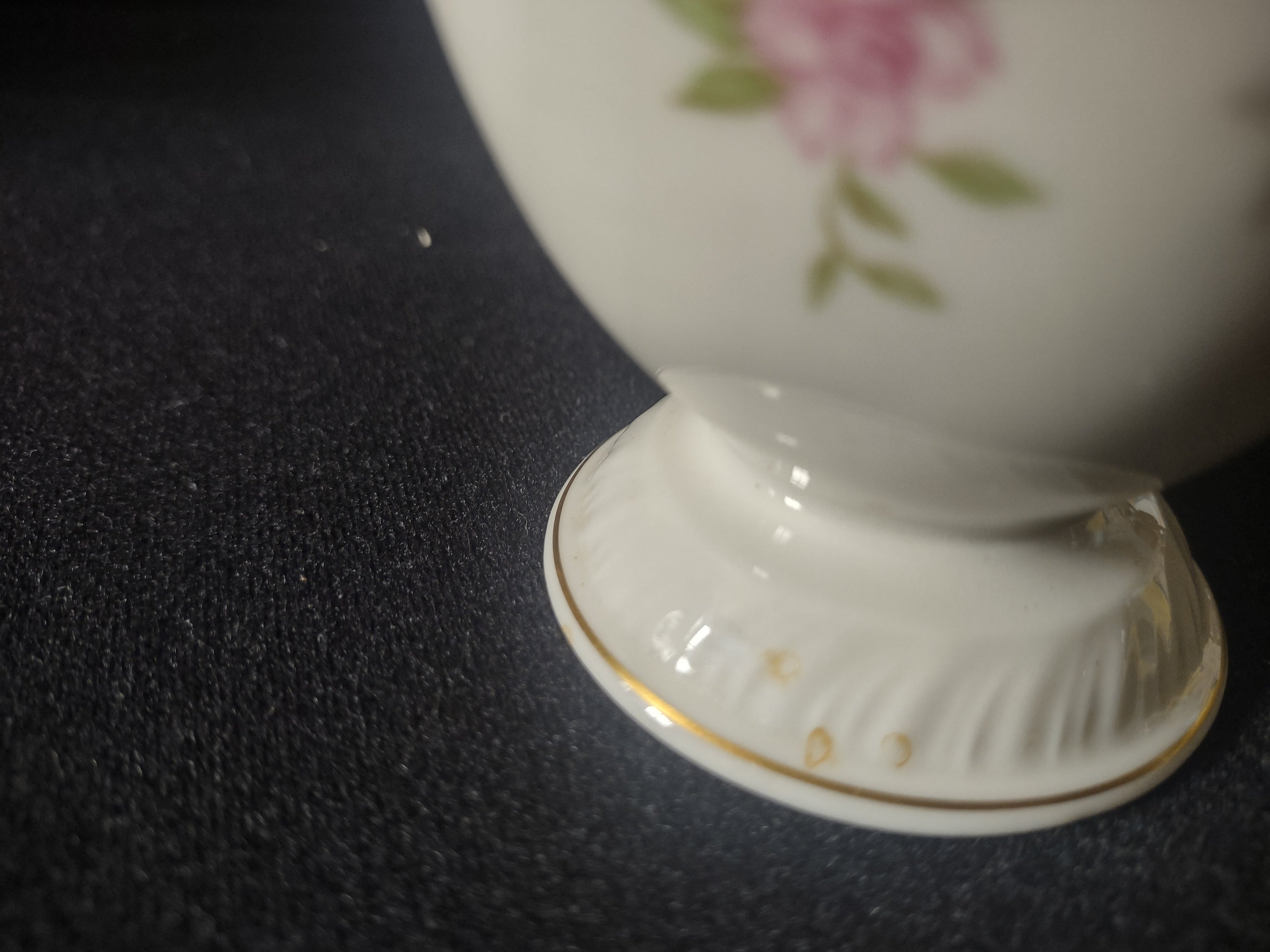 Vintage footed creamer bottom view