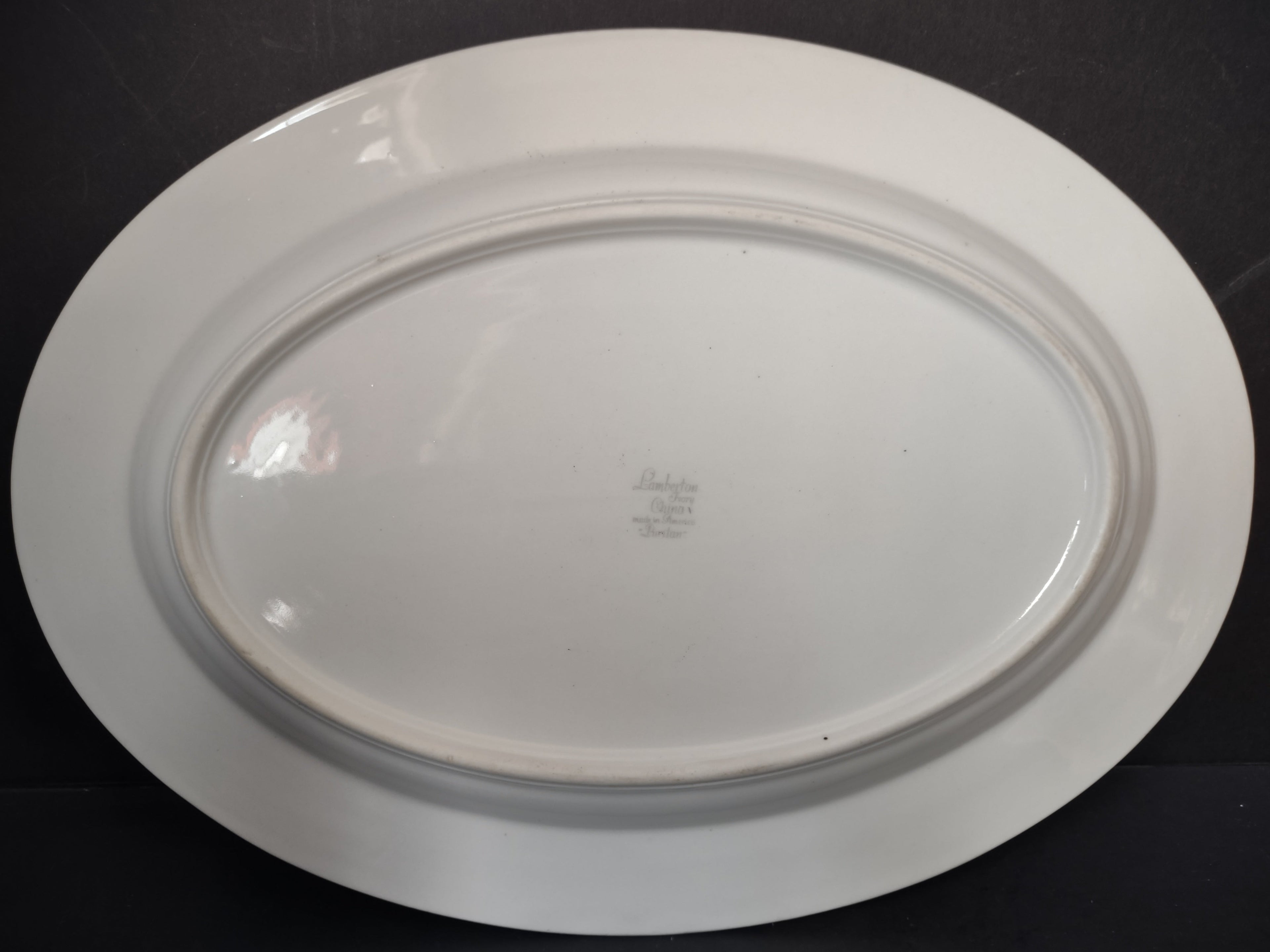 Front view of Lamberton China Puritan oval platter showing blue fleur-de-lis laurel border and central windmill vignette
