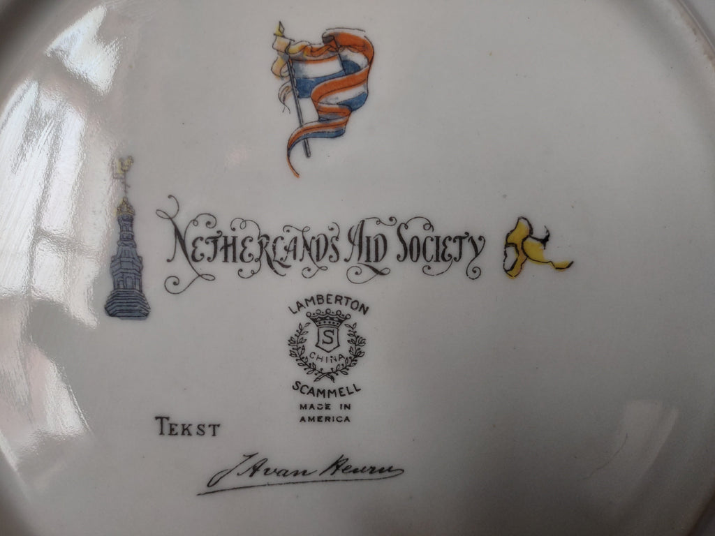 Back of Netherlands Aid Society plate showing full backstamp and off-white rim