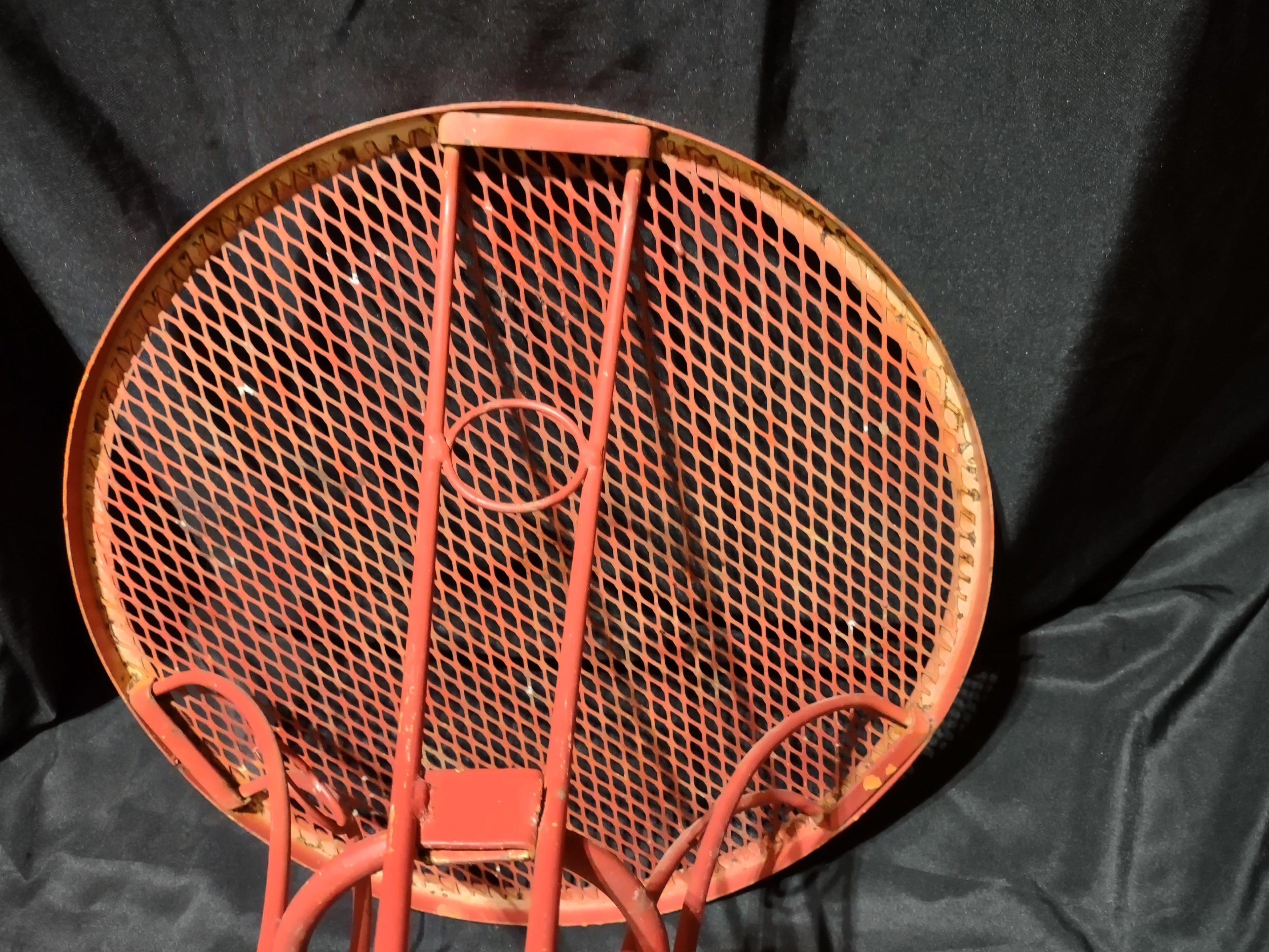Vintage red metal mesh bistro table - full assembled view