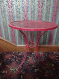 Vintage red metal mesh bistro table - base leg and brace detail