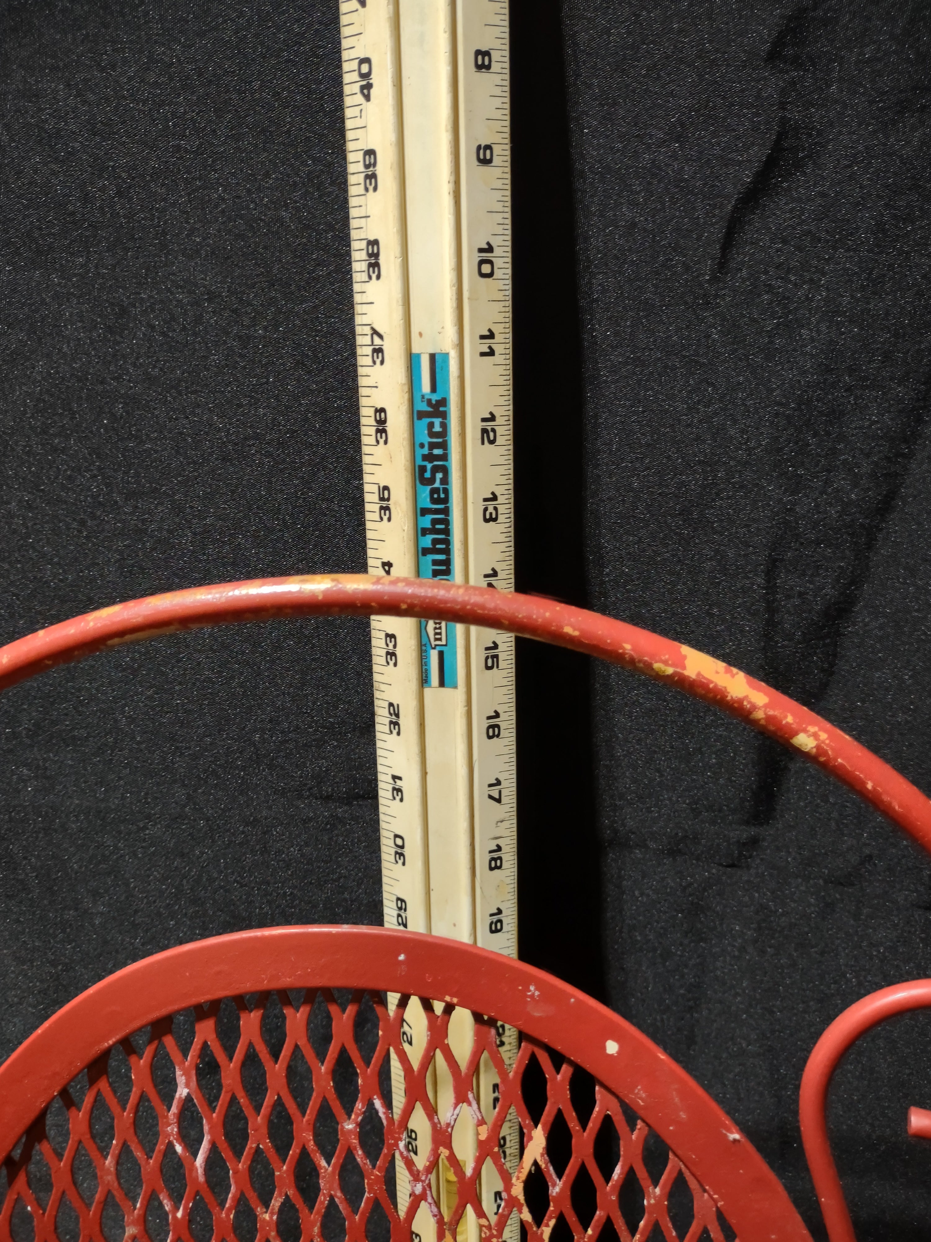 Vintage red metal mesh bistro chair - front view with ruler showing approximately 35-36 inch height