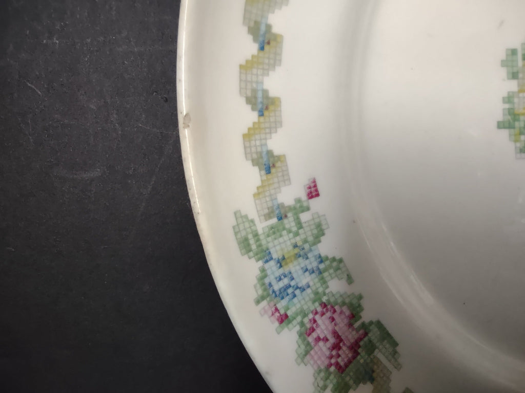 Vintage American Limoges Federal Sampler plate close-up of cross-stitch style zigzag border and floral clusters