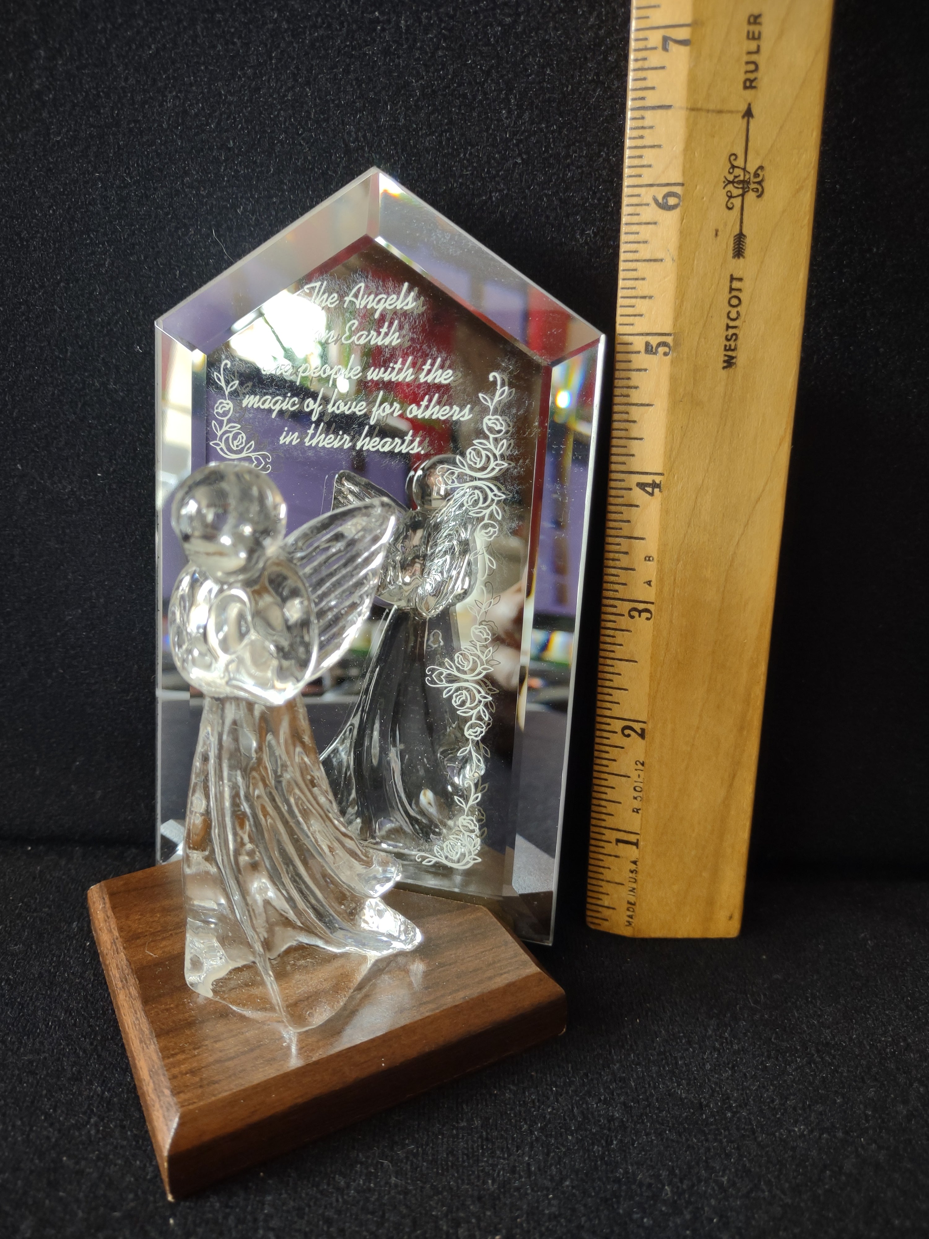 Close-up of engraved inscription on crystal mirror plaque - Angels on Earth quote