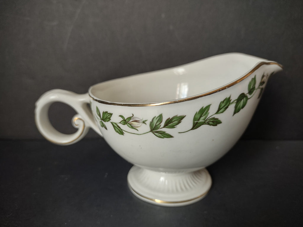 Vintage green ivy garland gold trim porcelain gravy boat - front right view showing scrolled handle