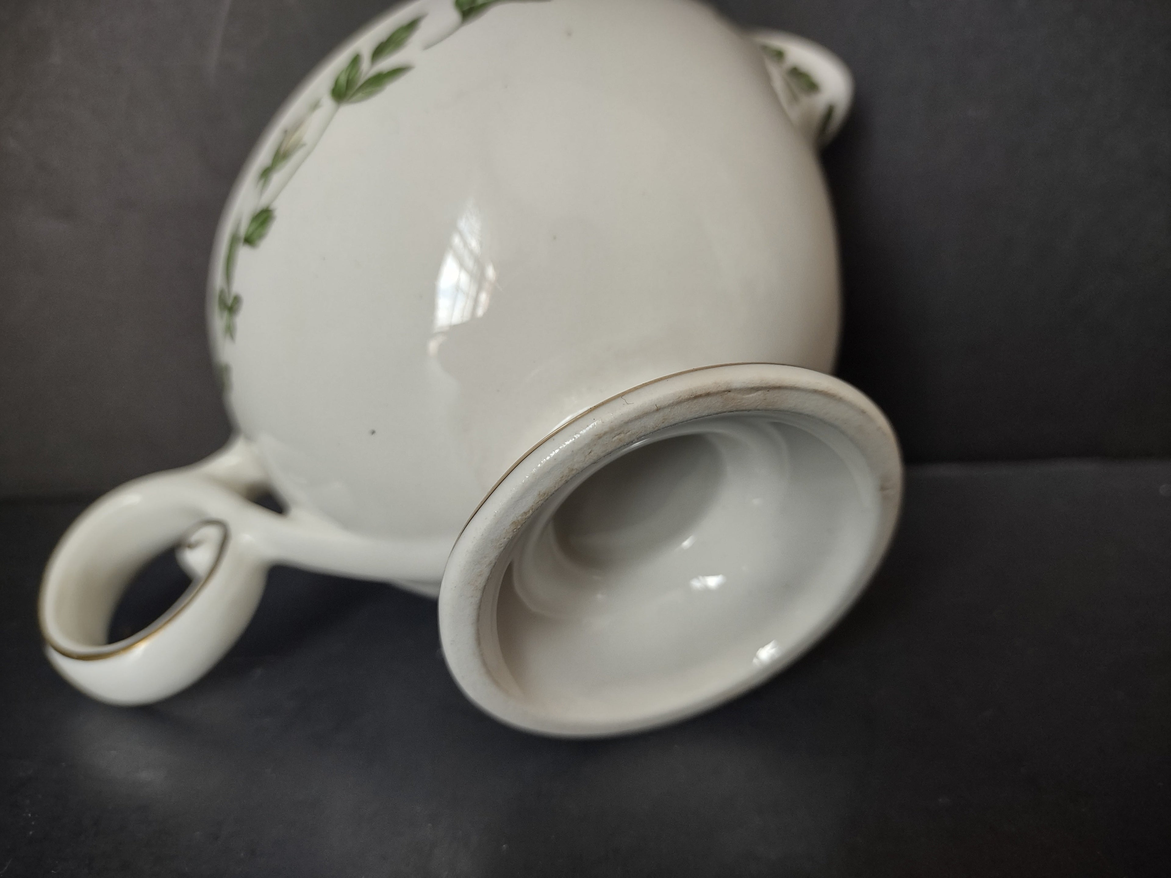 Vintage green ivy garland gold trim porcelain gravy boat - three-quarter view showing spout and pattern