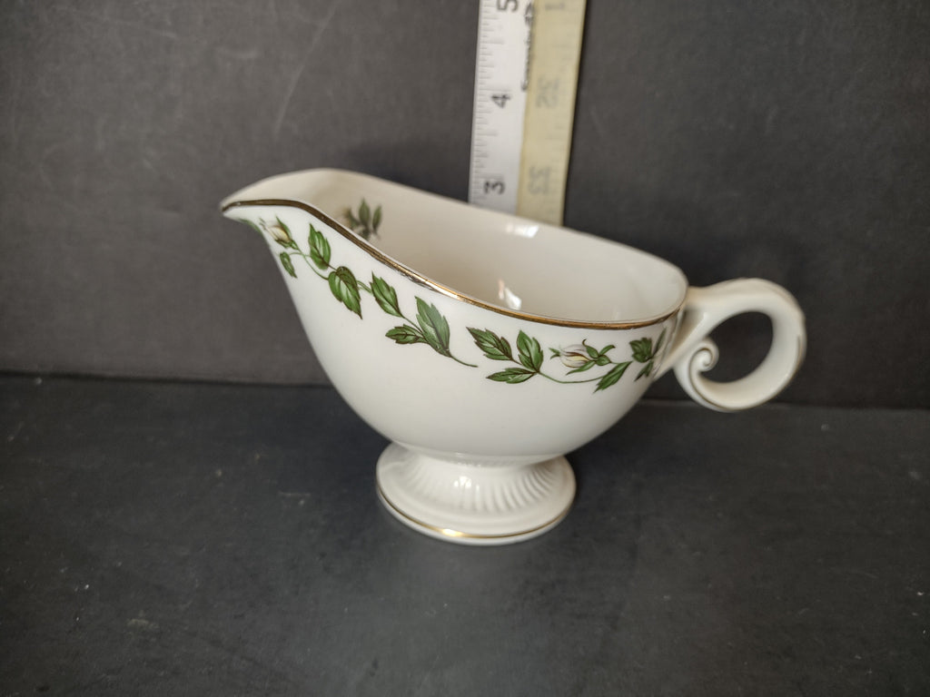 Vintage green ivy garland gold trim porcelain gravy boat - base view showing unmarked bottom and footed pedestal