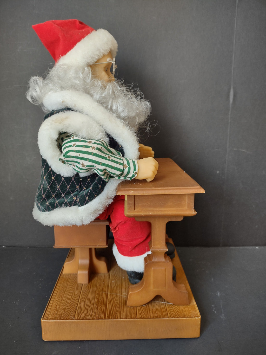 Vintage animated Santa Claus at school desk - ruler showing approximately 13 inches tall