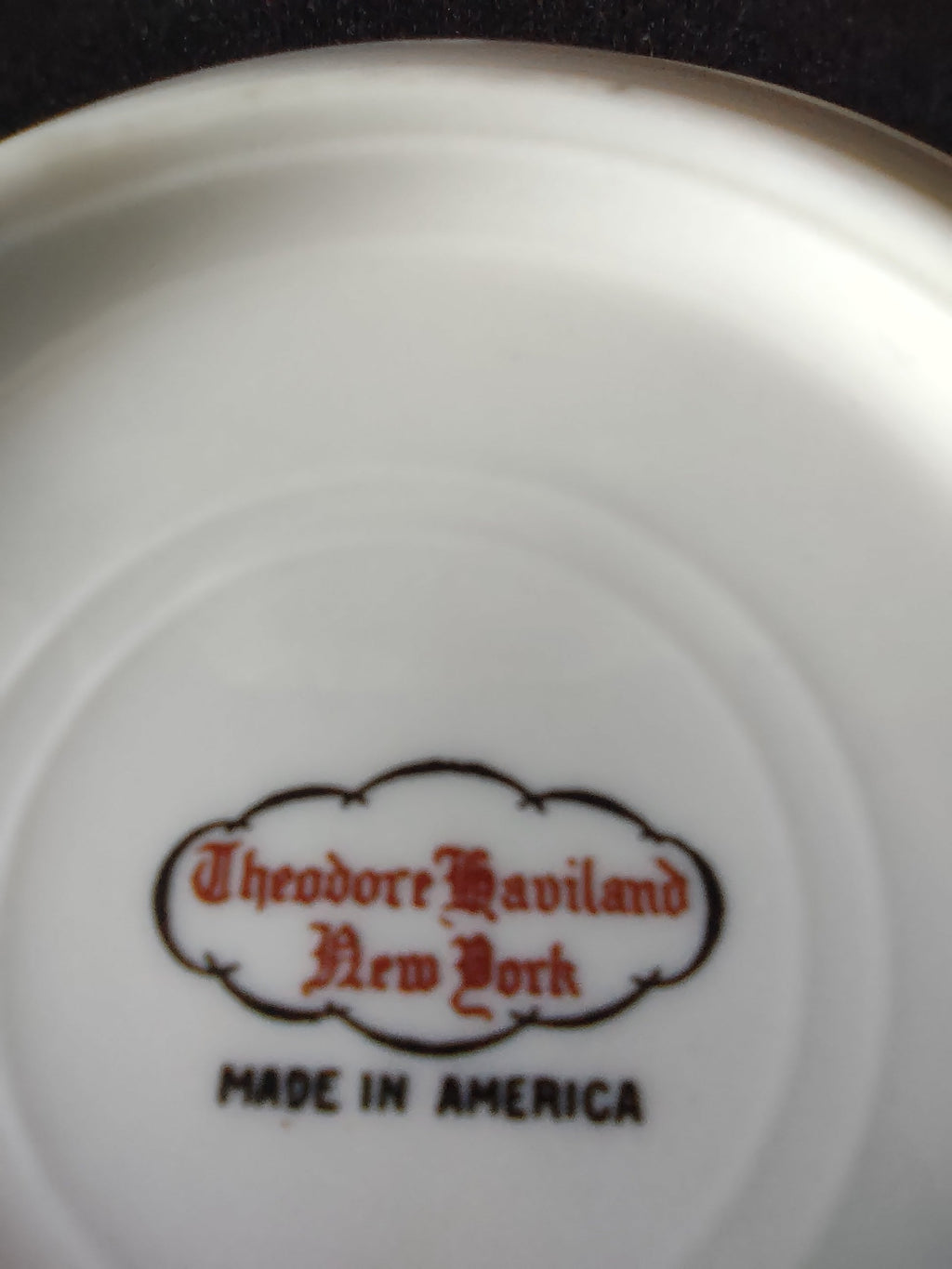 Close-up of Theodore Haviland New York Made in America backstamp in red script