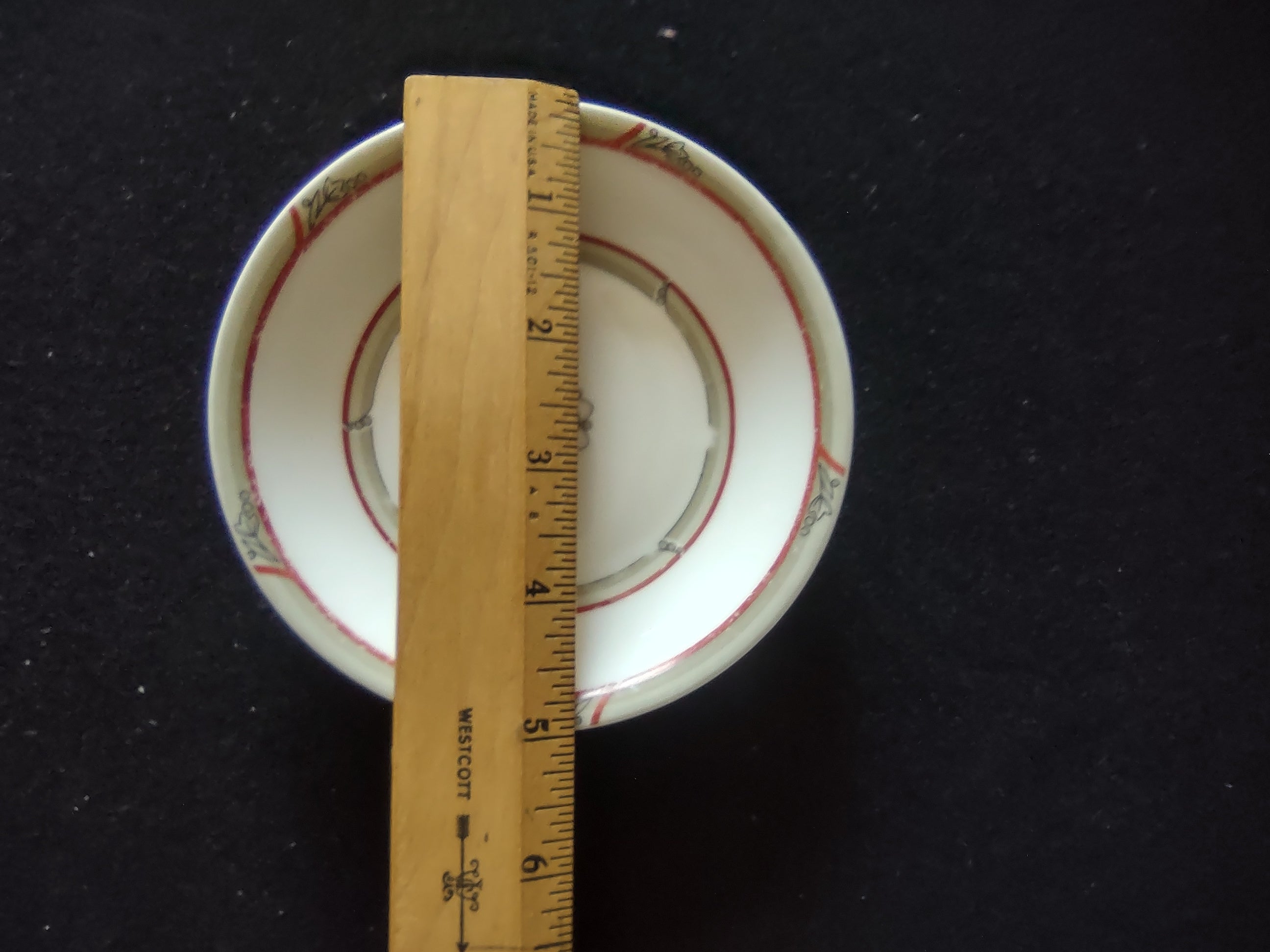 Back of Theodore Haviland New York saucer showing discoloration consistent with age