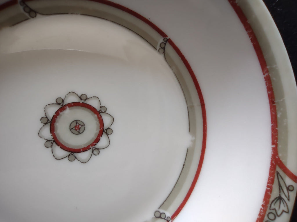 Side view of saucer with ruler showing approximately 5 inch diameter