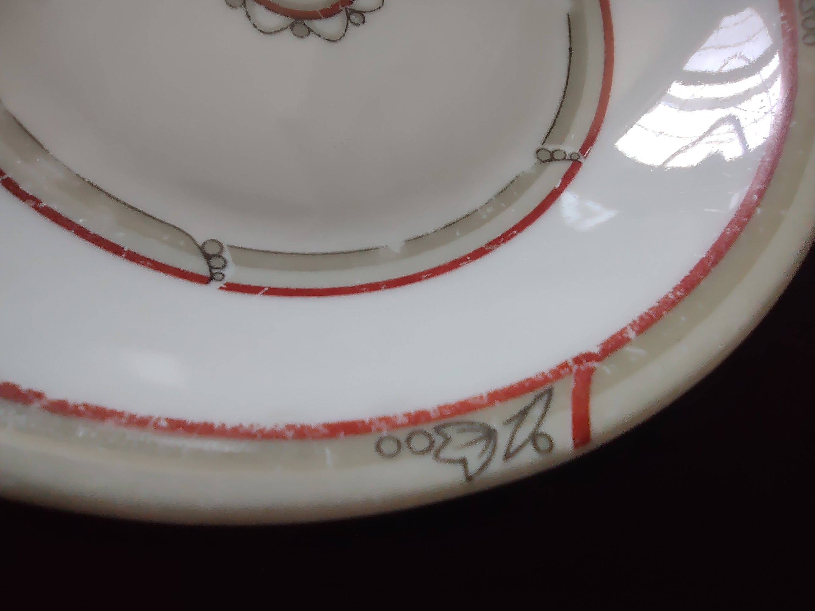 Close-up of red band wear and paint loss with pattern number 96300 visible