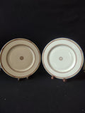 Close-up of scalloped red medallion center with red dot on white porcelain