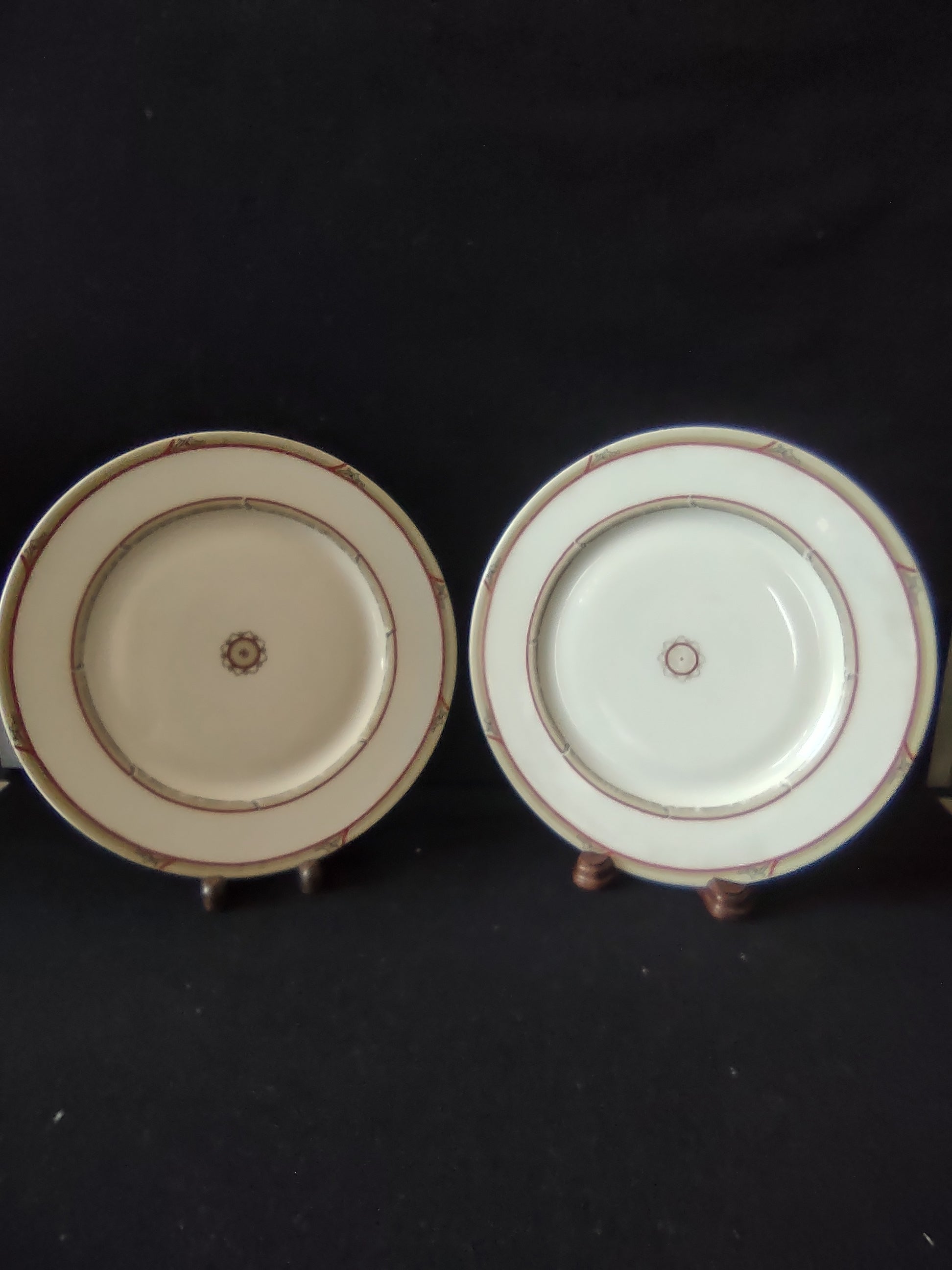 Close-up of scalloped red medallion center with red dot on white porcelain