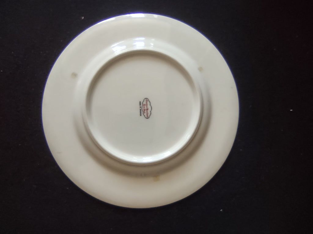 Set of 2 Theodore Haviland New York Art Deco red band plates on display stands showing front