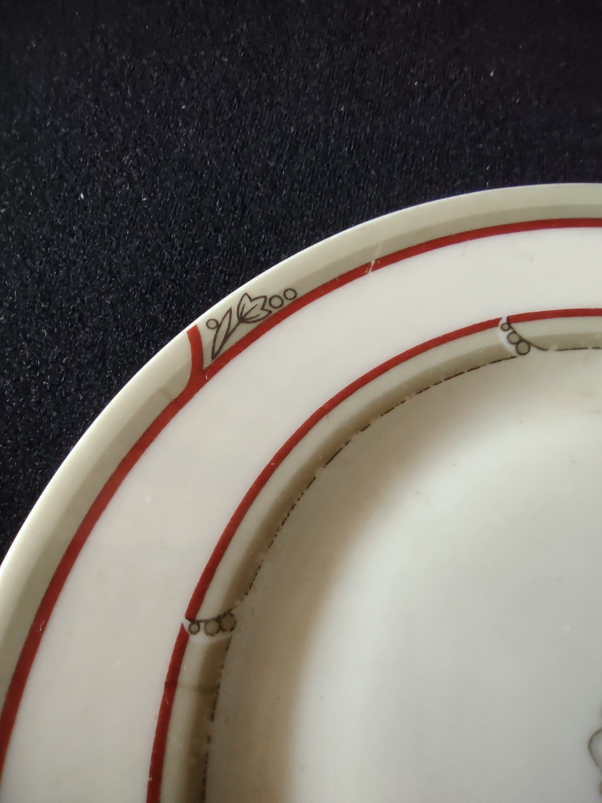 Back of Theodore Haviland New York plate showing backstamp and discoloration on underside rim