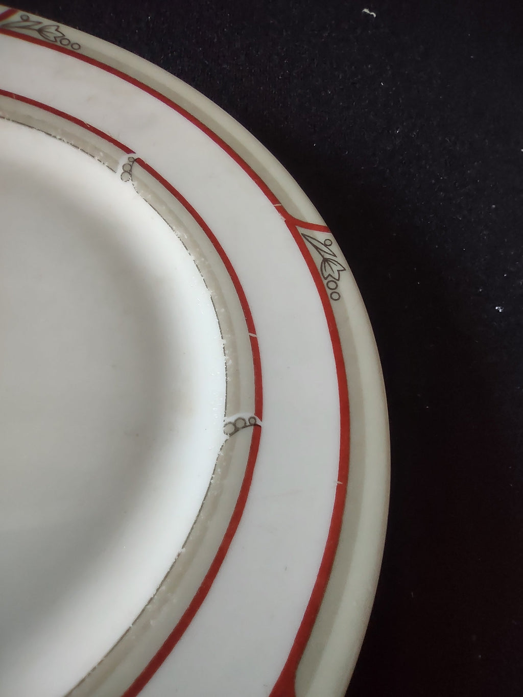 Close-up of underside rim showing age-related discoloration consistent with vintage use