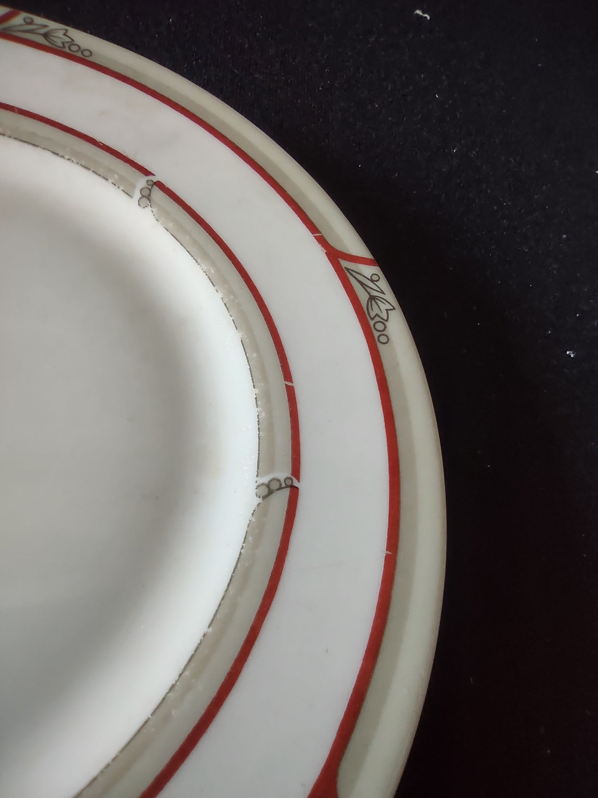 Close-up of underside rim showing age-related discoloration consistent with vintage use