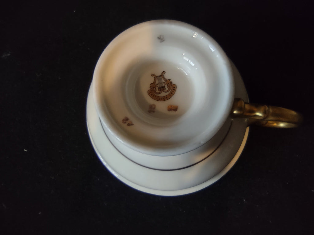 Castleton China Laurel saucer close-up of gold floral and leaf garland pattern