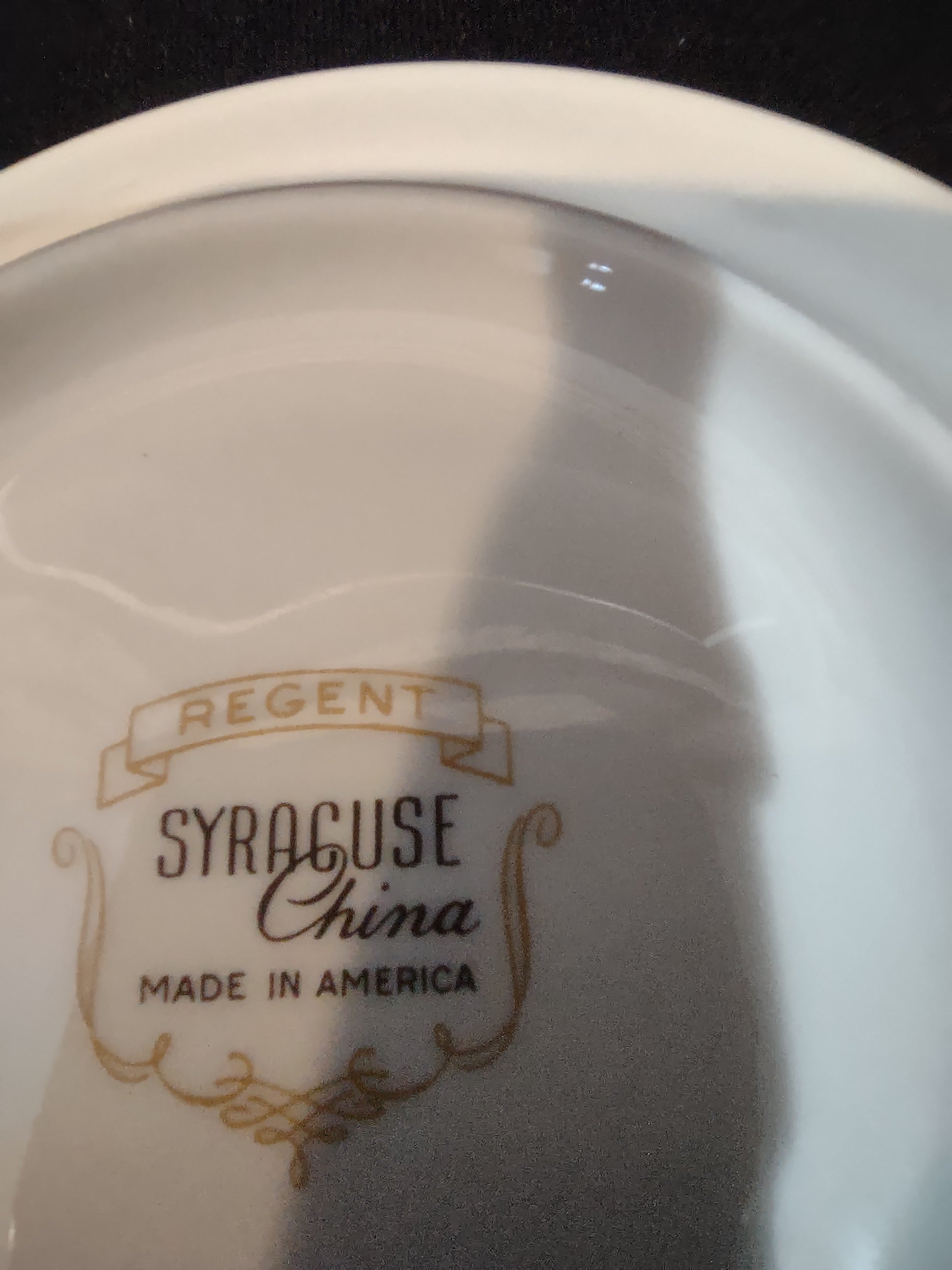 Backstamp reading Regent Syracuse China Made in America in gold on white porcelain base