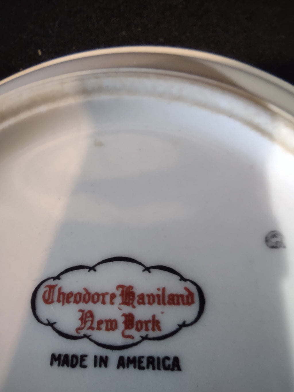 Backstamp reading Theodore Haviland New York Made in America in red script on white porcelain base