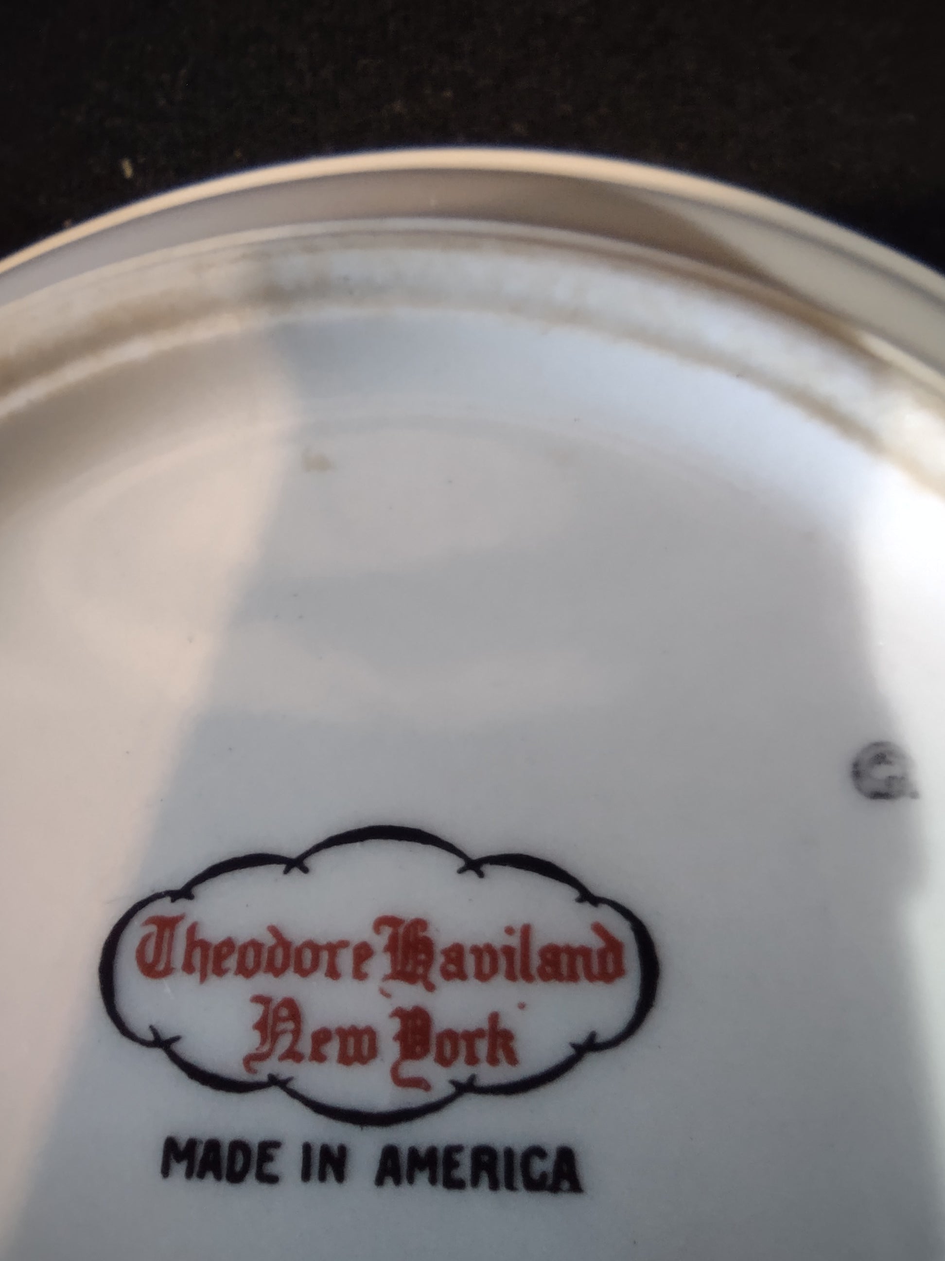 Backstamp reading Theodore Haviland New York Made in America in red script on white porcelain base