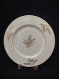 Close-up of gold wheat sheaf motif in center of Lenox Harvest plate
