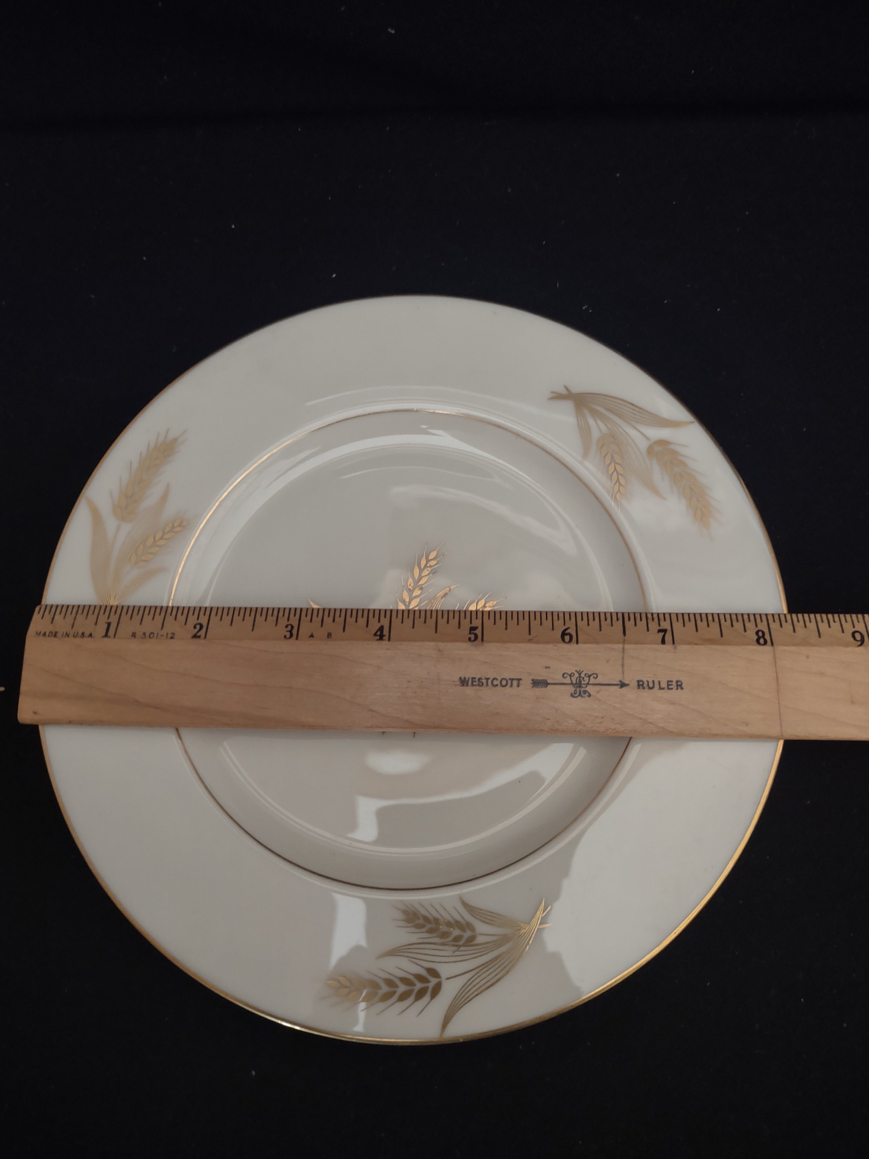 Close-up of gold wheat motif on rim of Lenox Harvest plate