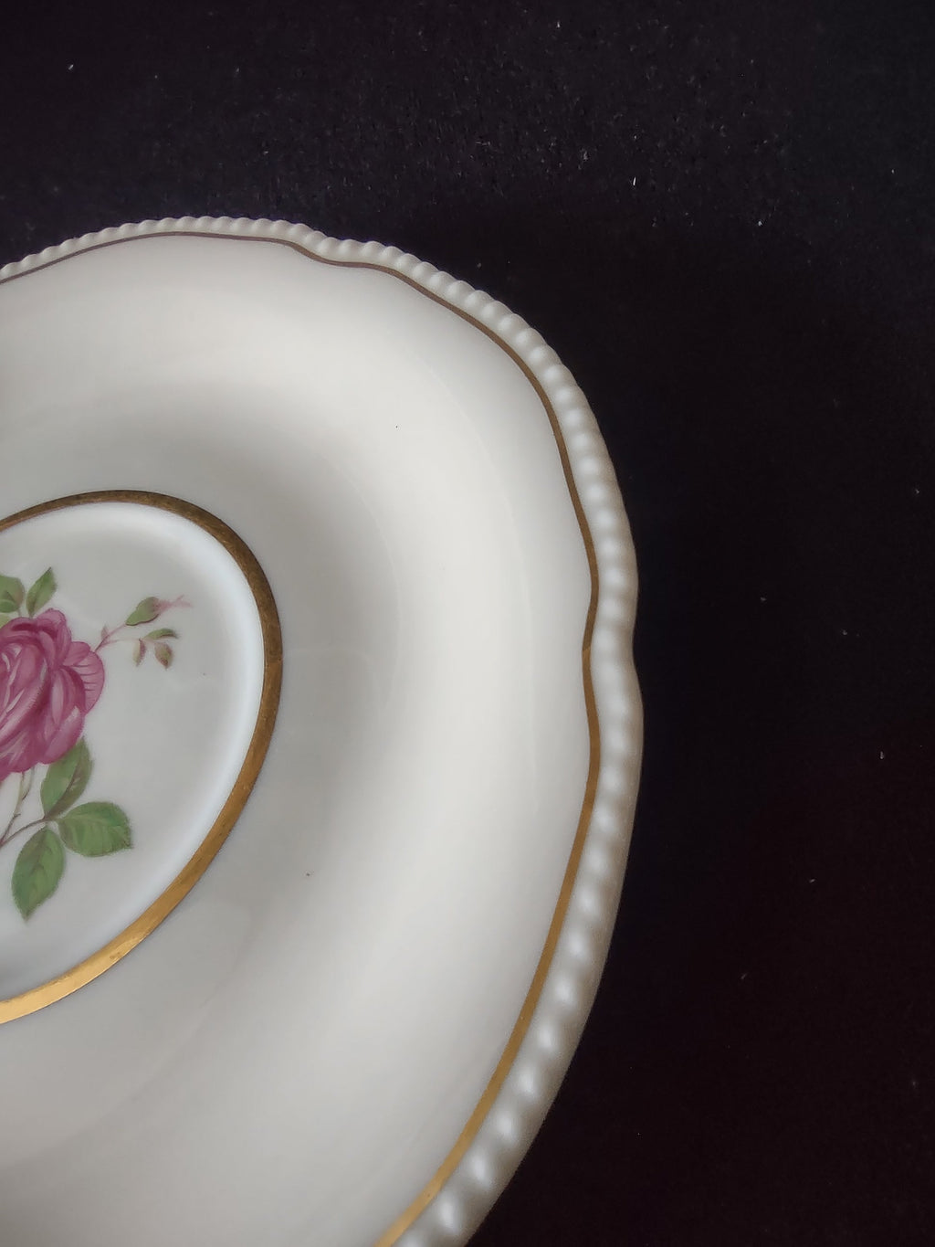 Close-up of pink rose center medallion with gold ring on Castleton Dolly Madison saucer