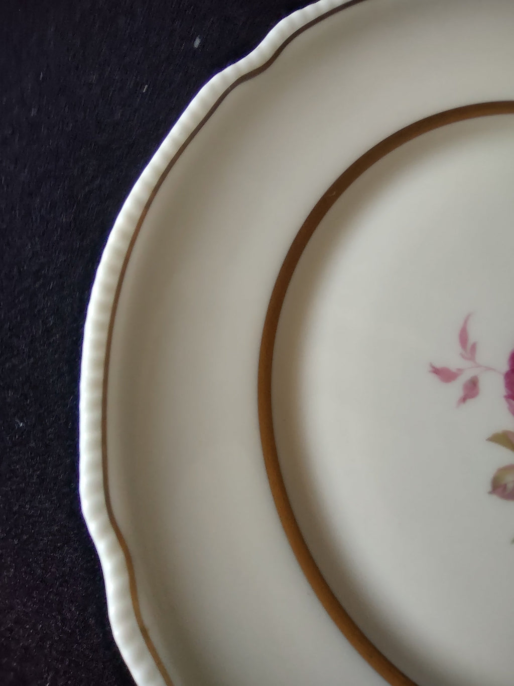 Close-up of pink rose and green foliage center motif on Castleton Dolly Madison plate