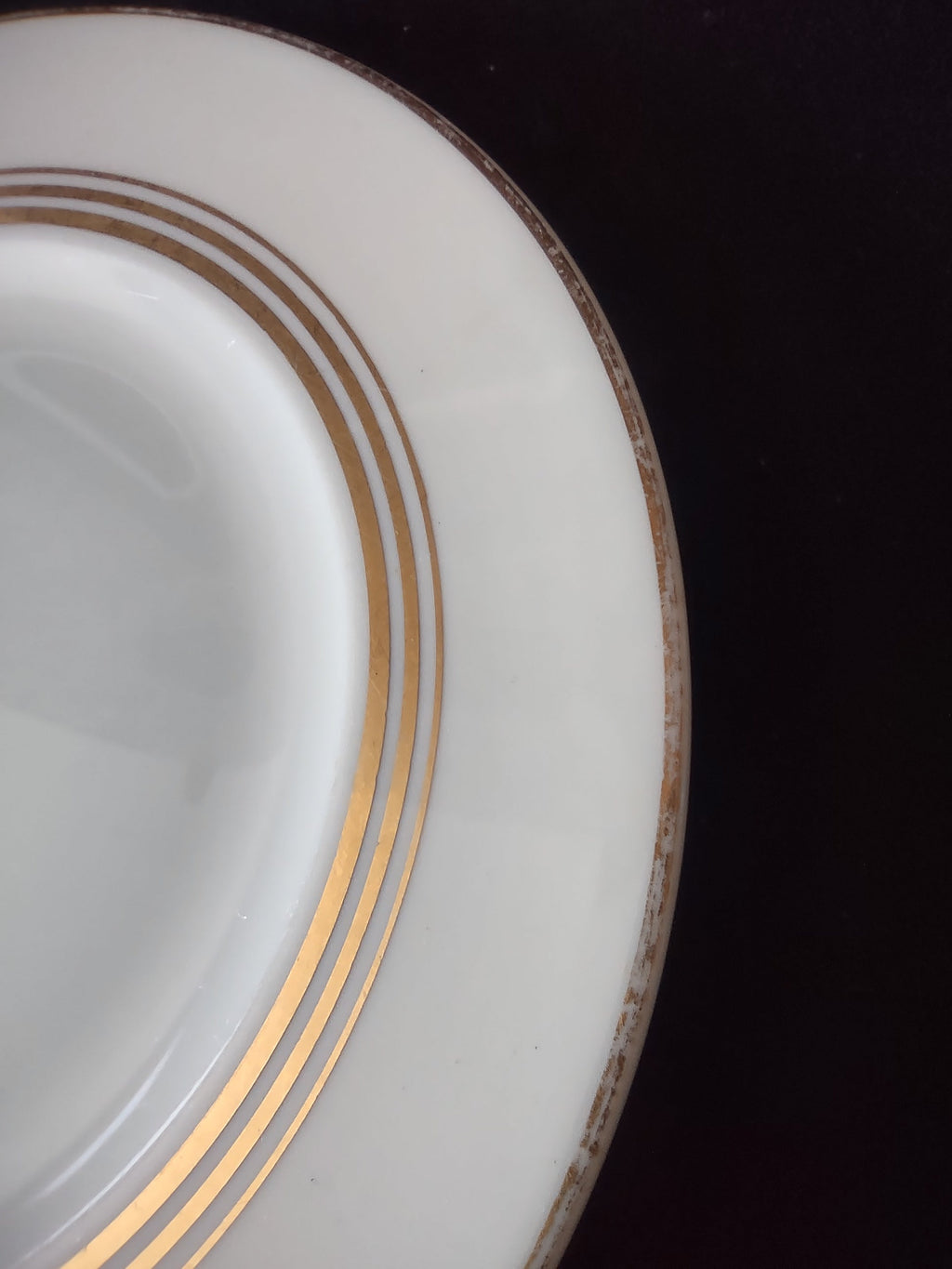 Set of 3 Syracuse China Old Ivory triple gold band plates displayed on stands