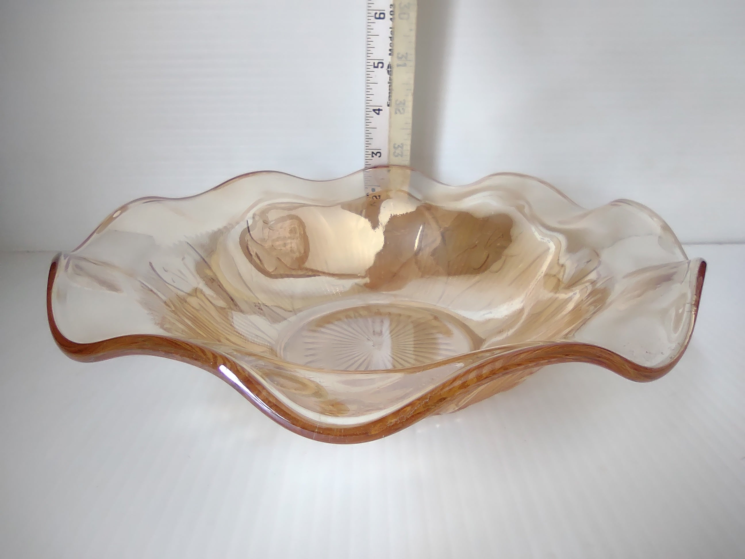 Vintage marigold carnival glass ruffled wave bowl side profile