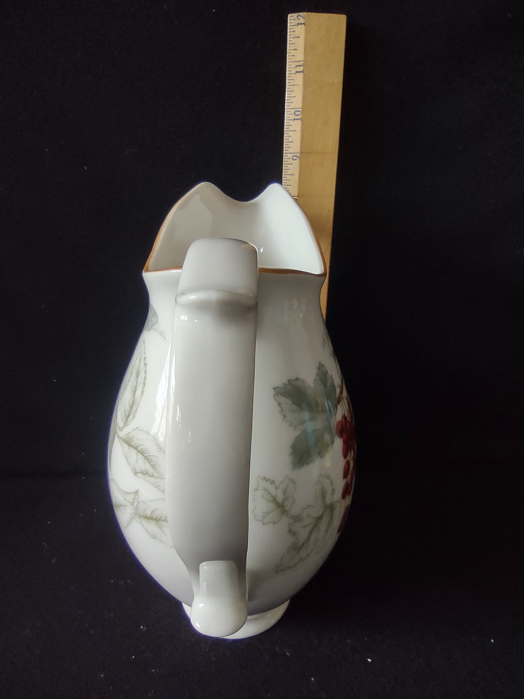 Close-up of Charter Club pitcher handle detail showing elegant curved form