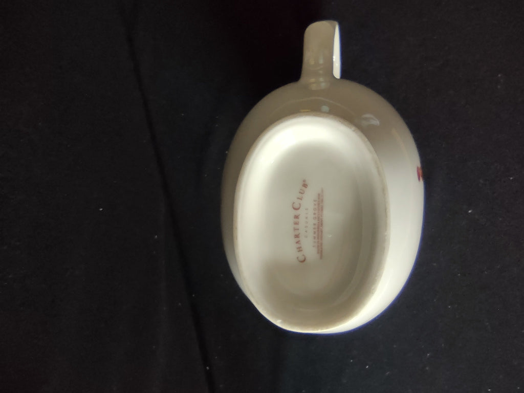Charter Club pitcher three-quarter view showing gold rim trim and berry pattern