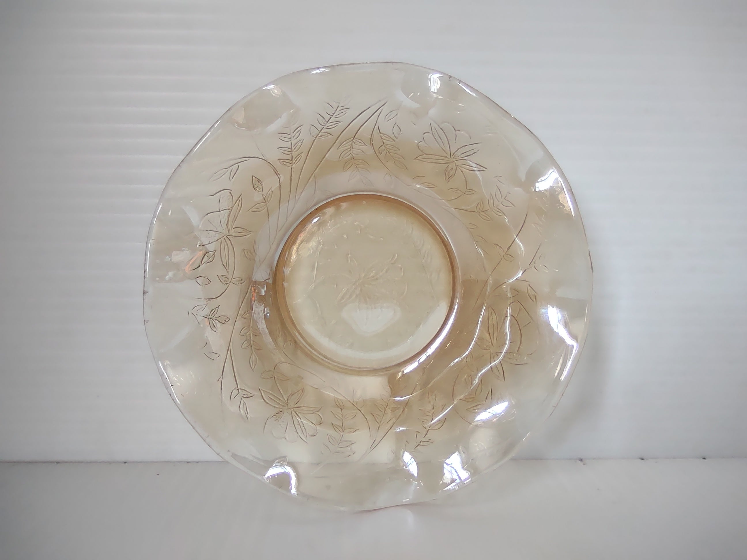 Vintage marigold carnival glass ruffled bowl iris floral coin dot side view