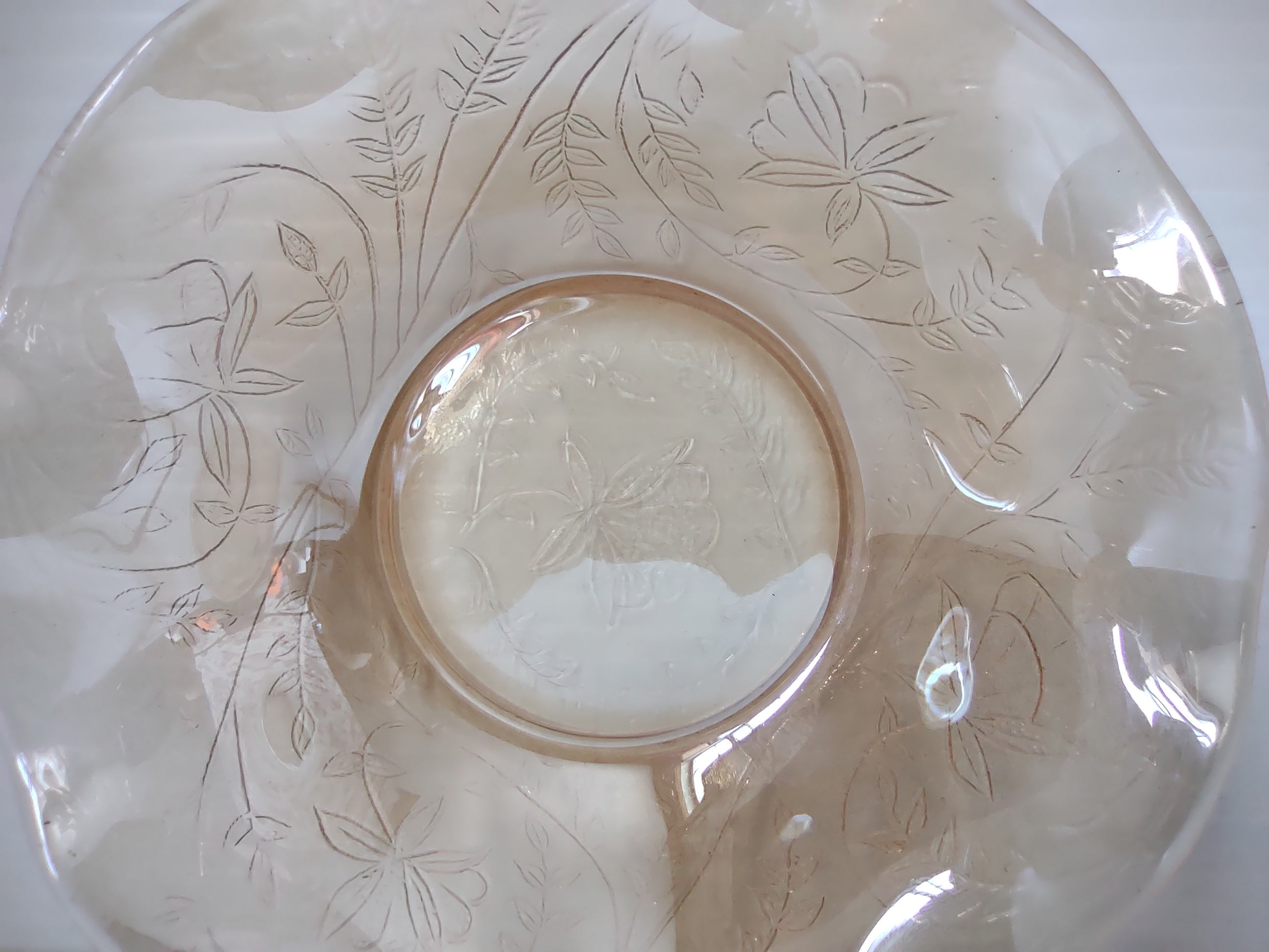 Vintage marigold carnival glass ruffled bowl with ruler showing width