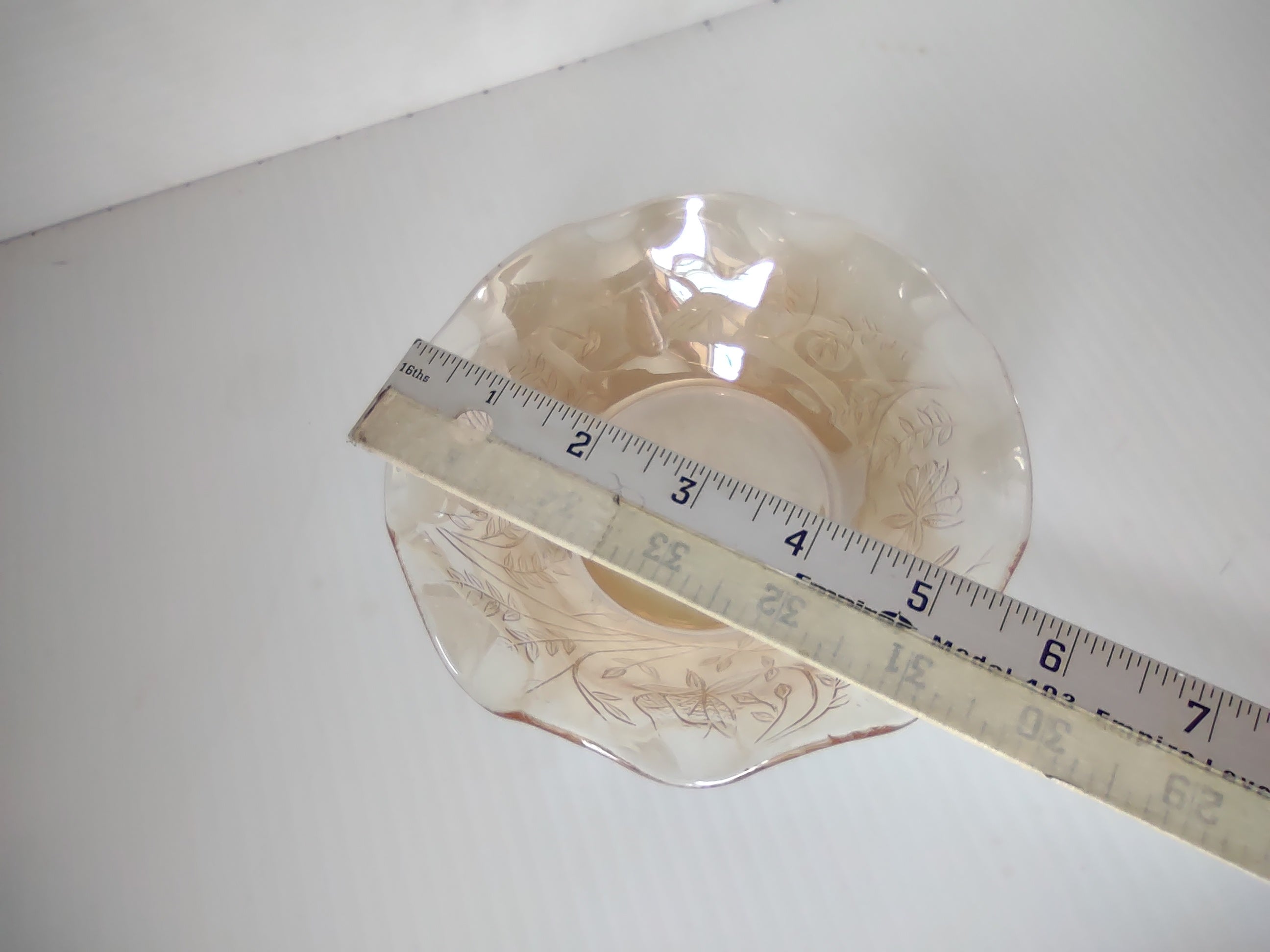 Vintage marigold carnival glass ruffled bowl interior floral detail