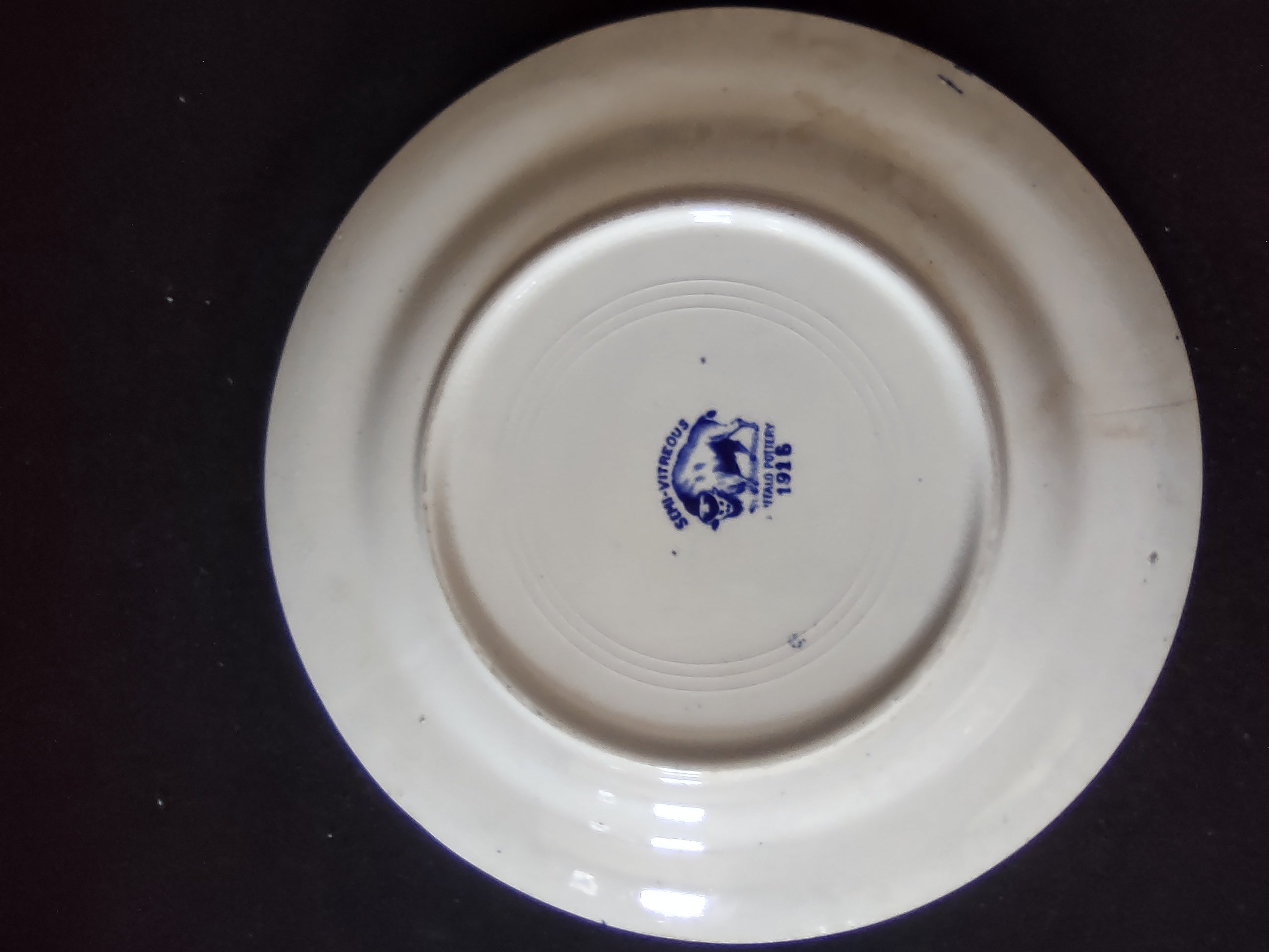 Vintage Buffalo Pottery Blue Willow Plate with ruler showing 7.5 inch size