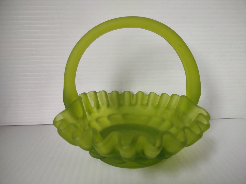 Side view of lime green satin glass hobnail basket with ruler showing approximately 6 inches tall
