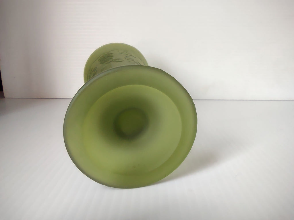 Side view of olive green satin glass footed trumpet vase with ruler showing approximately 9 inches tall