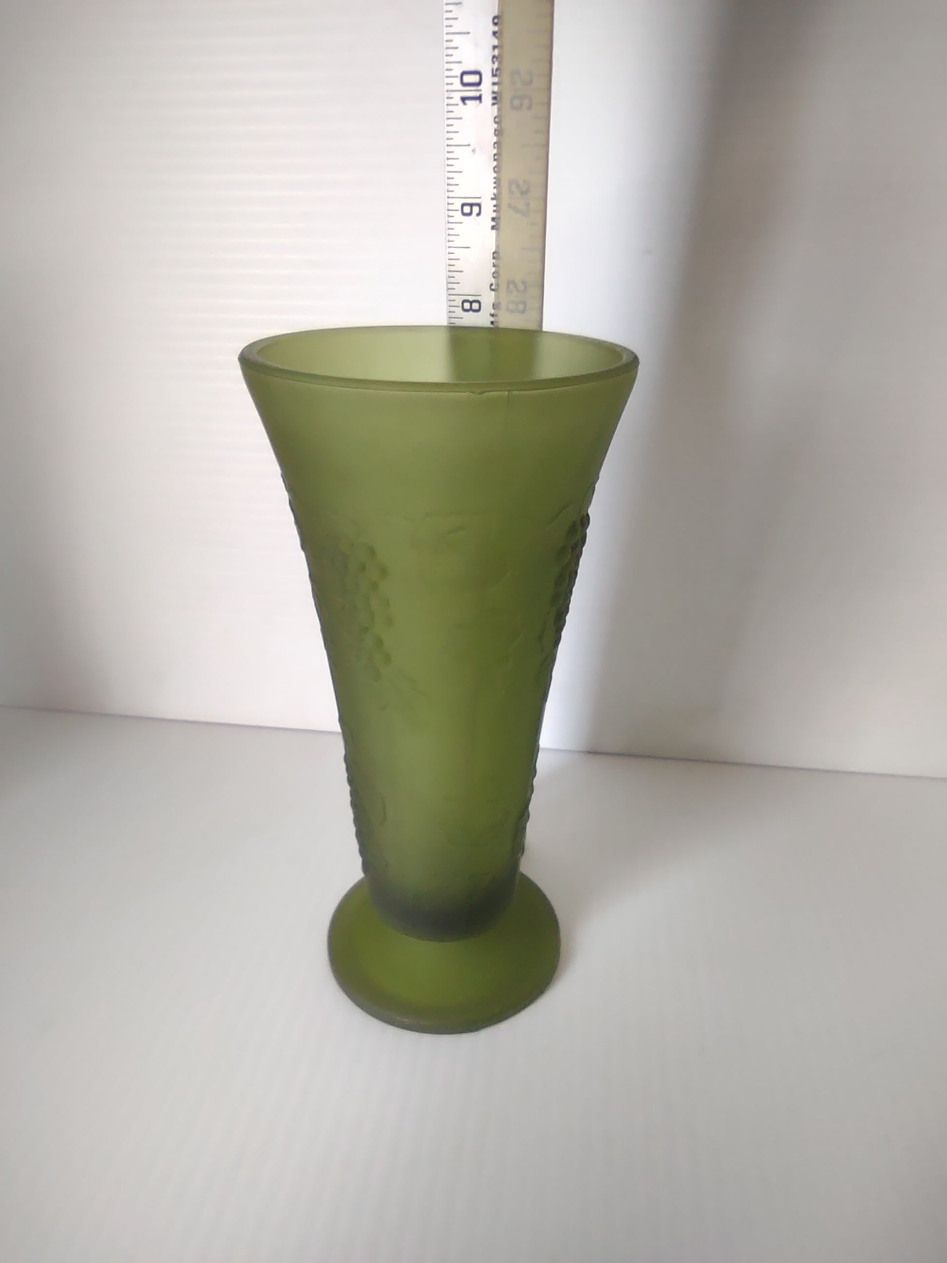 Bottom view of olive green satin glass footed trumpet vase showing no maker's mark