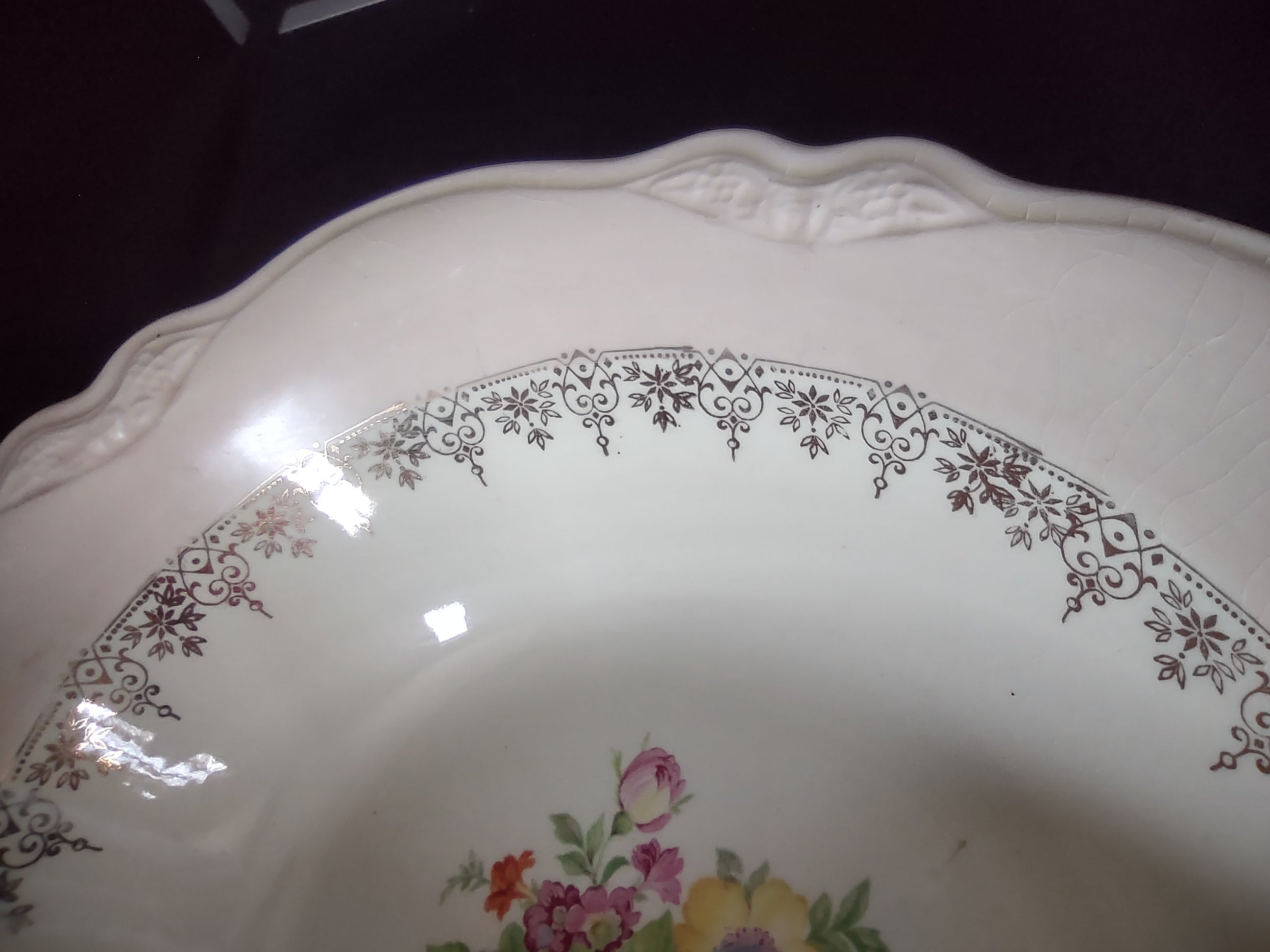 Vintage Homer Laughlin Virginia Rose serving bowl - angled interior view showing gold scrollwork border detail